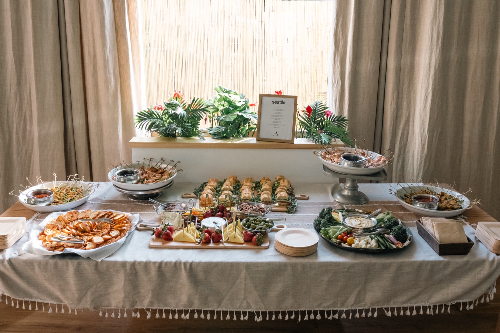 A catered food spread laid out for an event at The KINN
